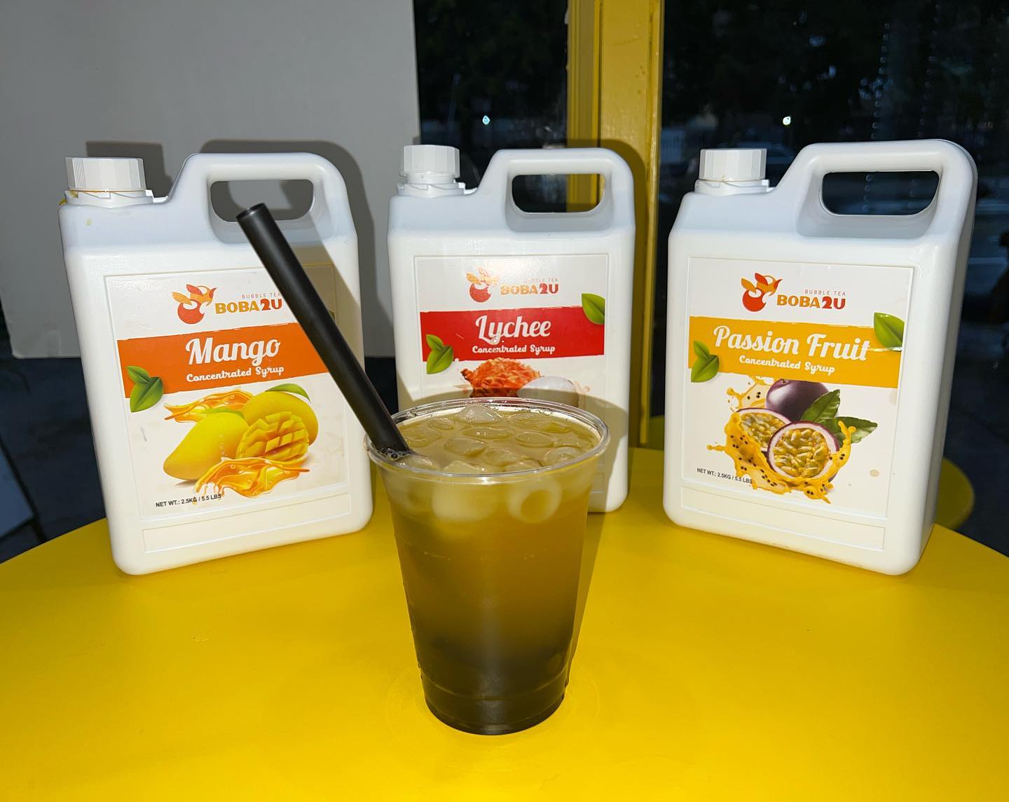 Boba and fresh drinks on Sunshine Café's bright-yellow table