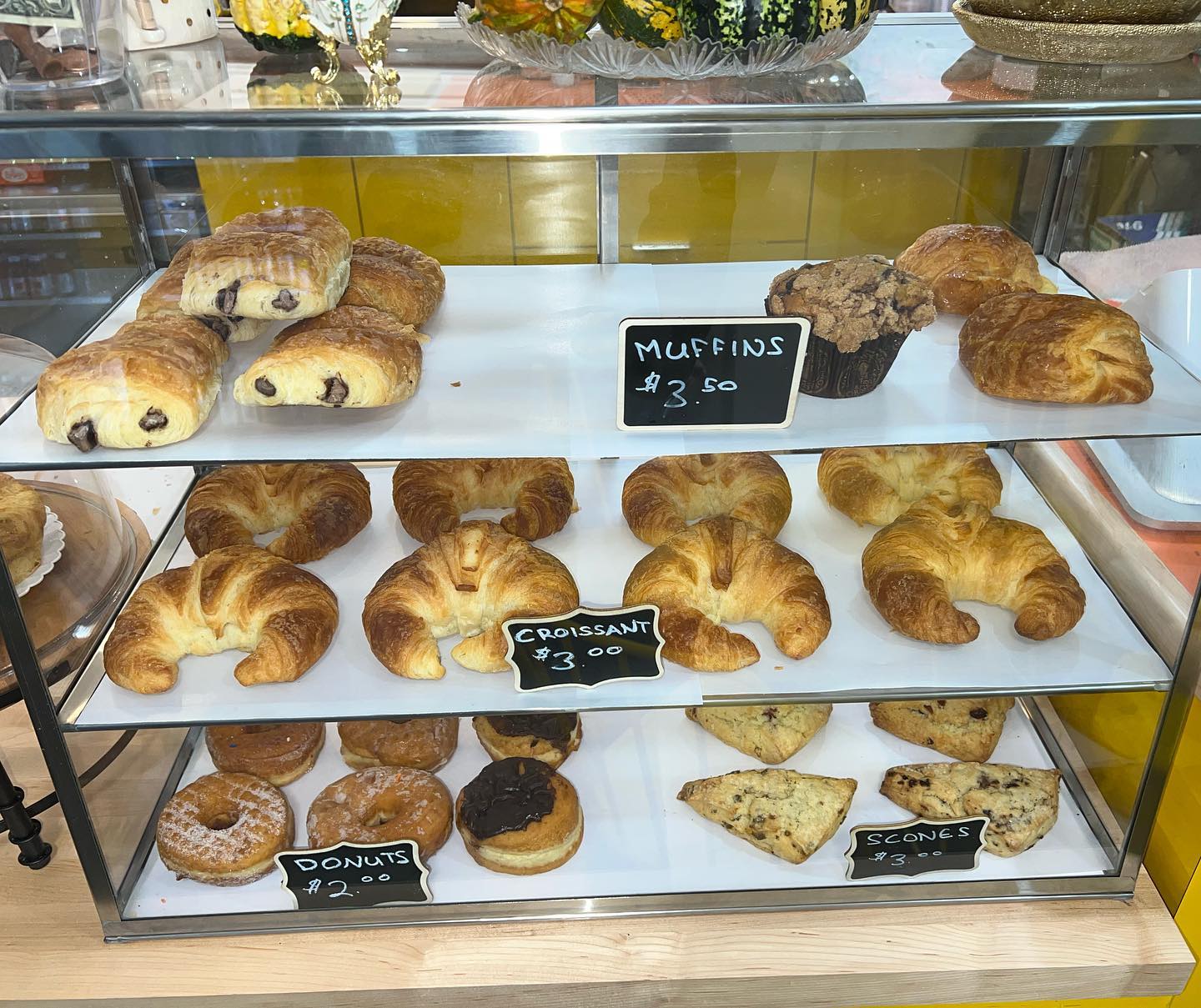 Sunshine Café's pastry case, where regulars leave good-luck charms
